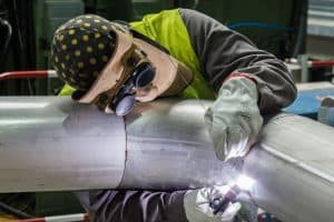 TIG welder welding a pipe