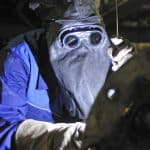 welder with goggles